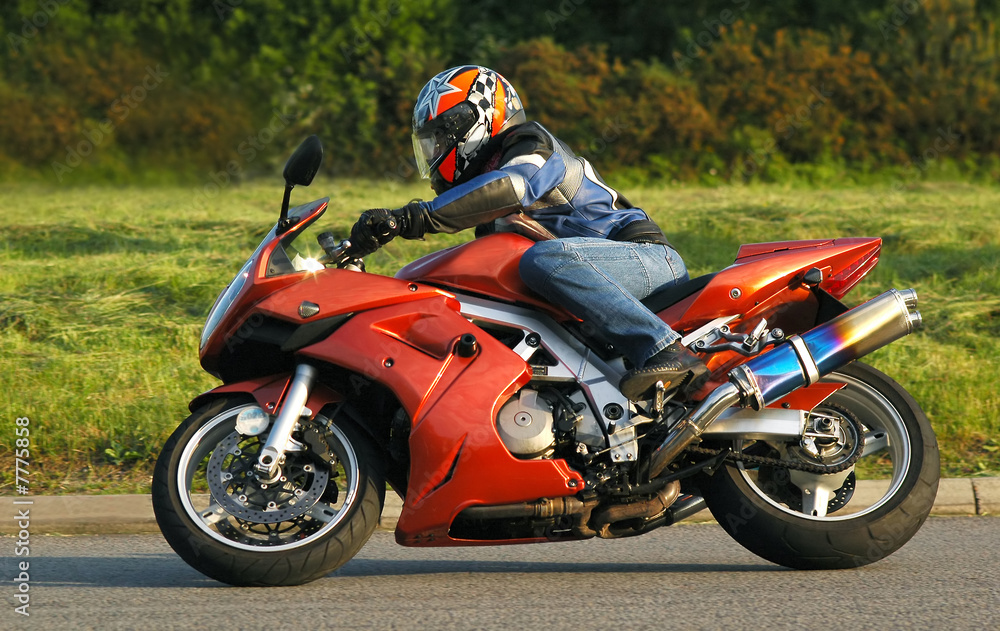 motorcycle rider cornering at speed