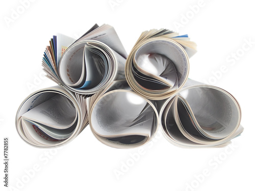 Roled newspaper isolated on white
