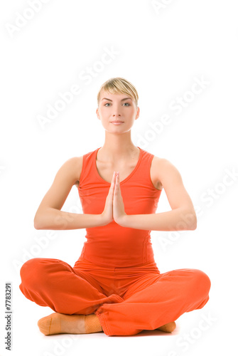 Beautiful young woman doing yoga exercise 