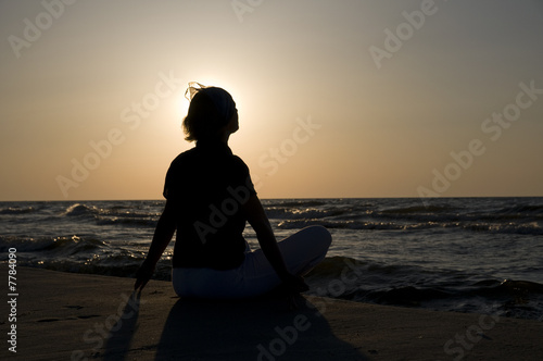 Meditation on the beach at sunset