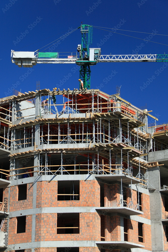 Construction crane against blue sky