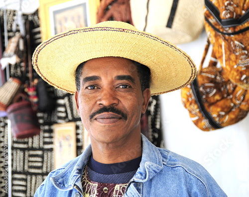 Caribbean shop owner.