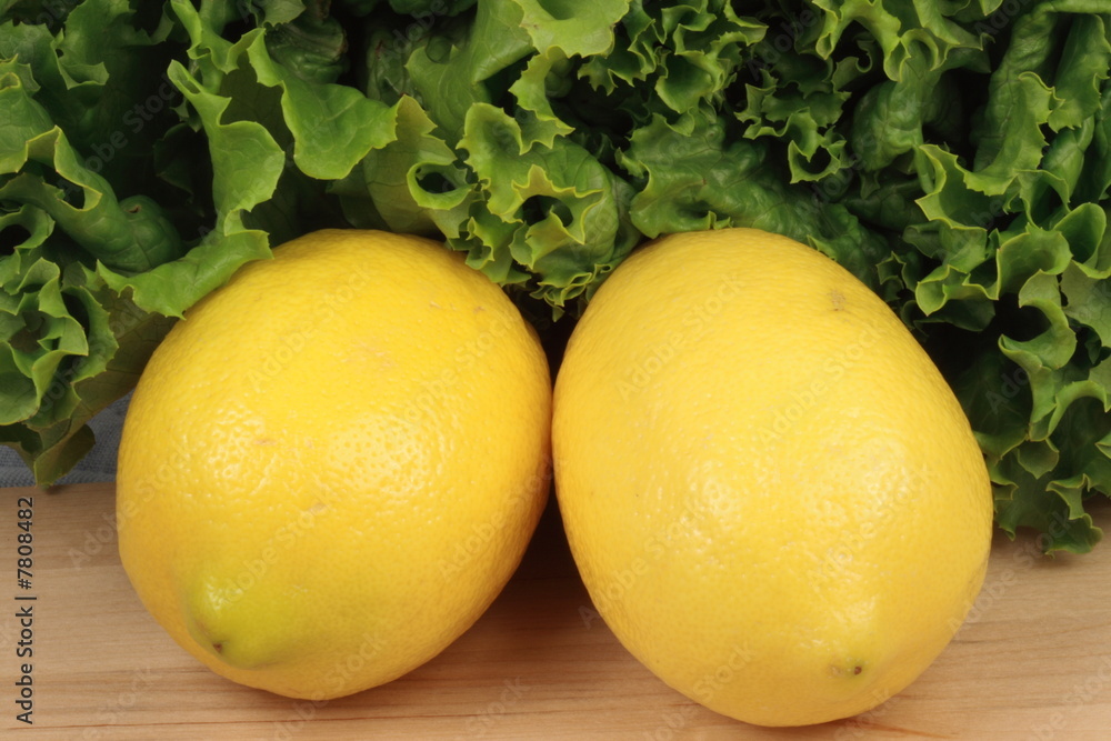 fresh lemons  with lettuce background 