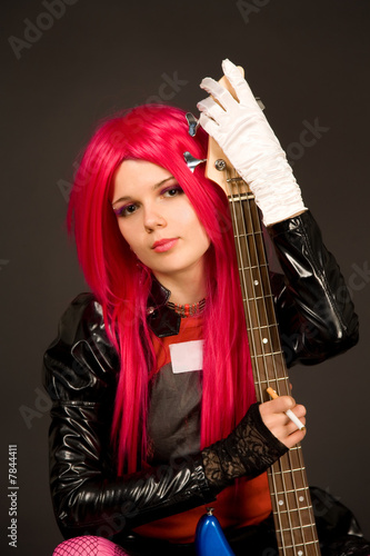 Portrait of a romantic girl with guitar