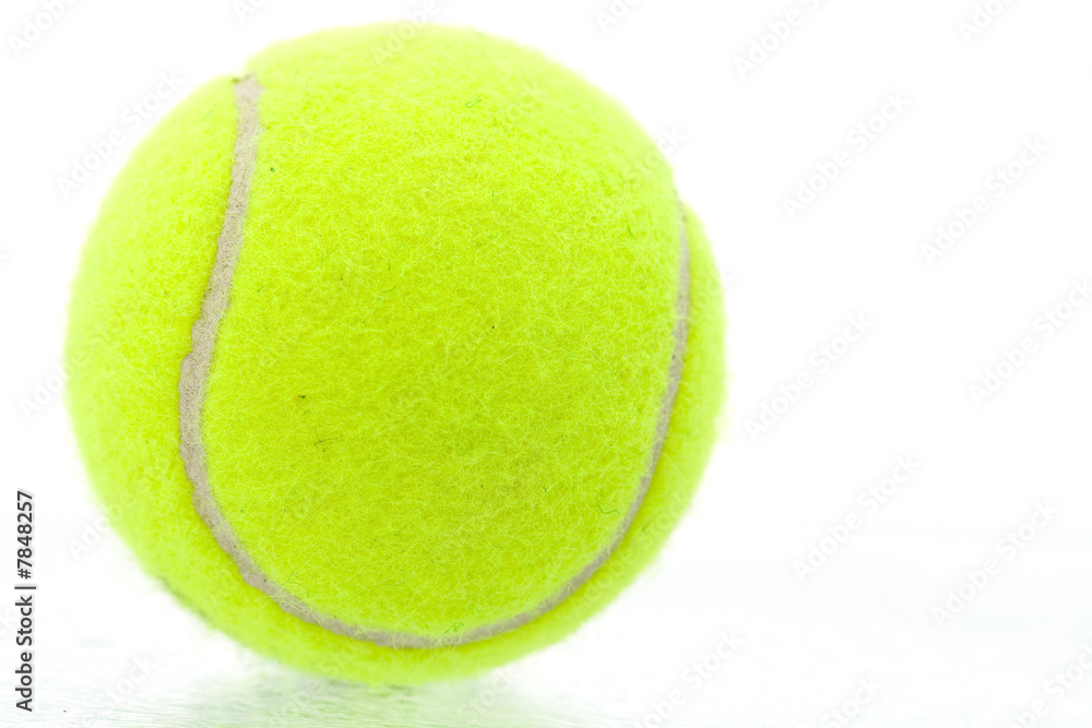 Yellow tennis ball on white background