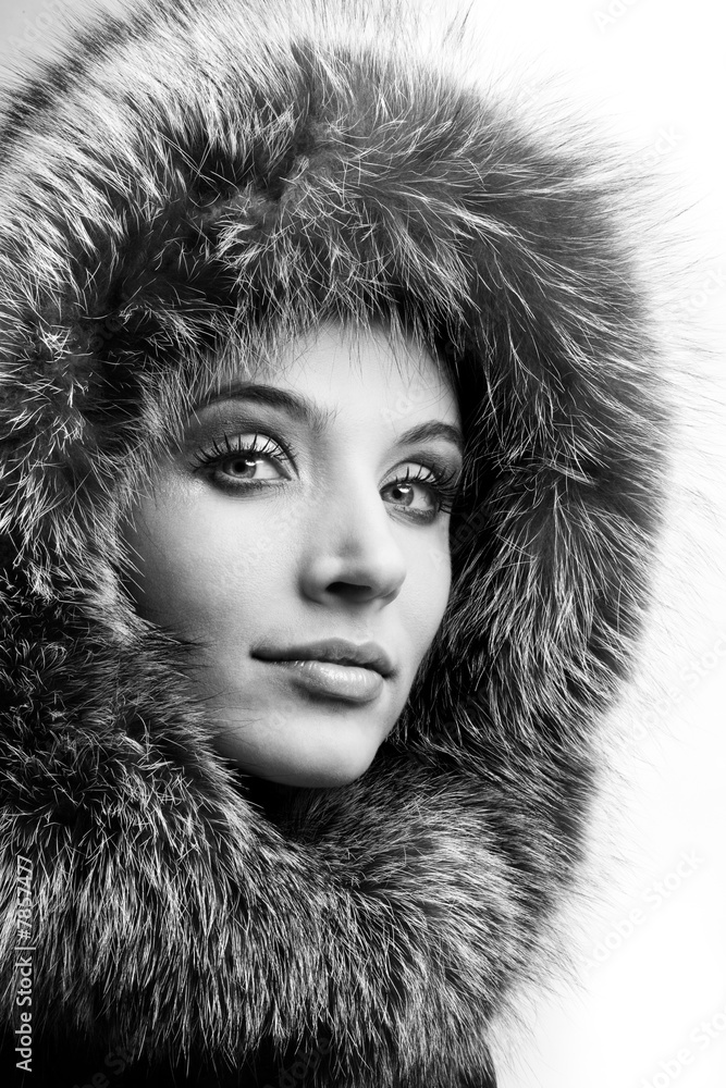 Portrait of the beautiful young woman with a fur hood Portrait of the beautiful young woman with a fur hood