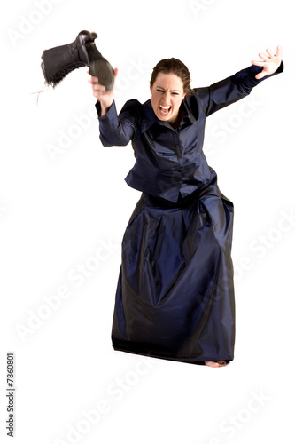 Woman with long curly hair throwing her boot