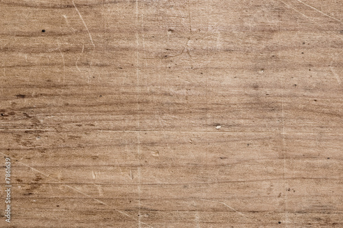 Old scratched wooden table.