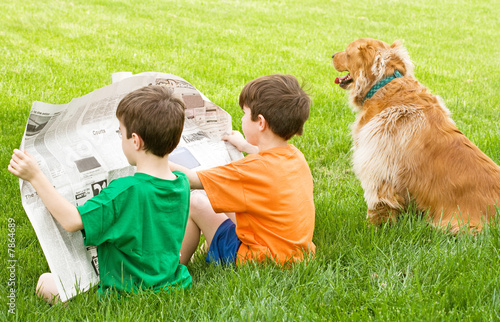 Two Boys Reading the Newspaper