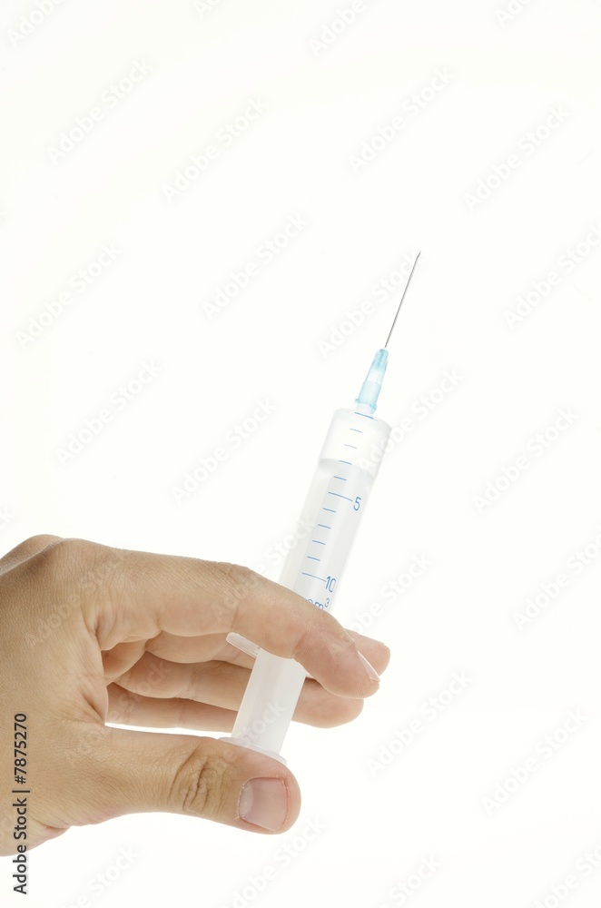 Syringe in hand close-up isolated on white background Syringe in hand close-up isolated on white background