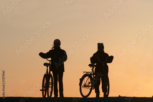 Two girls on bicycles