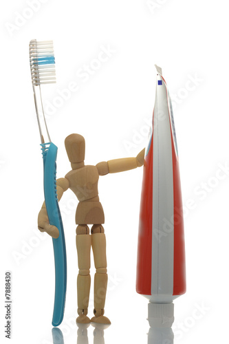 manikin with toothbrush and toothpaste
