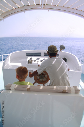 little boy and captain on the boat 2 © jordano