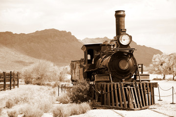 Fotobehang Trein Antieke Amerikaanse stoomtrein in landschap  © konstantant