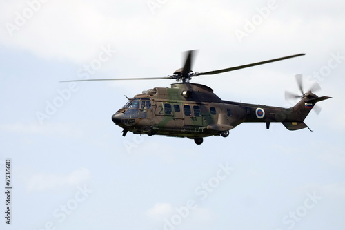 Military helicopter Cougar in flight.