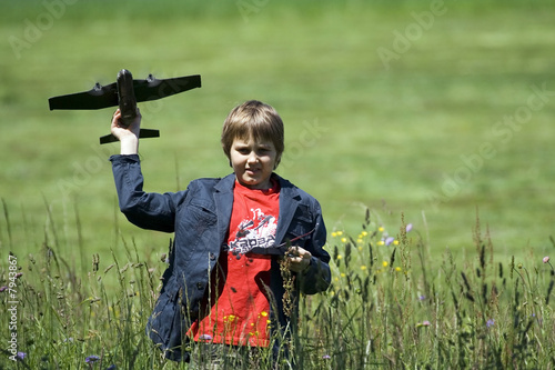 Boy playing with the remote control plane.