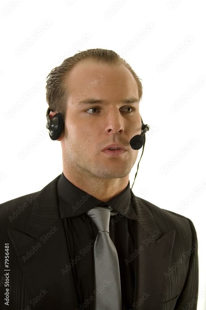 Successful young businessman wearing headphones Successful young businessman wearing headphones