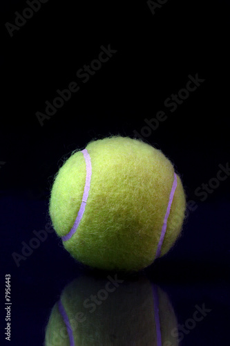 Tennis ball on black background