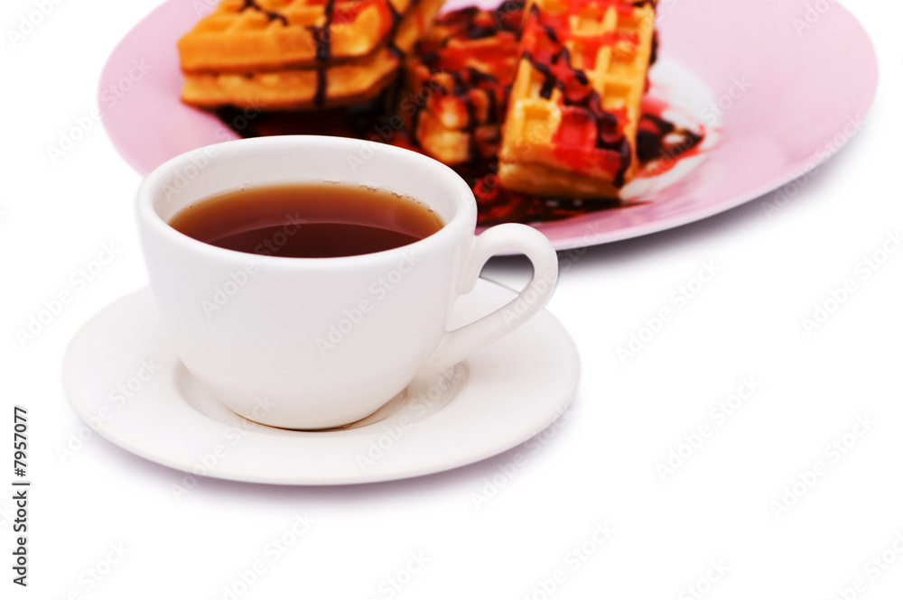 Tea and belgian waffles isolated on the white Tea and belgian waffles isolated on the white