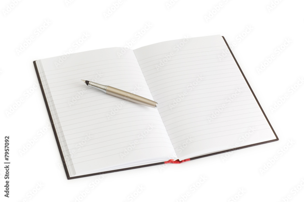 Pen over the notebook isolated on the white Pen over the notebook isolated on the white