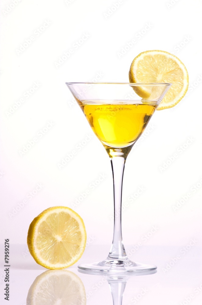 Yellow cocktail with lemon on white background