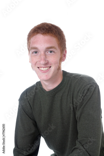 Fotografia Red headed teenage boy with sideburns and a friendly smile