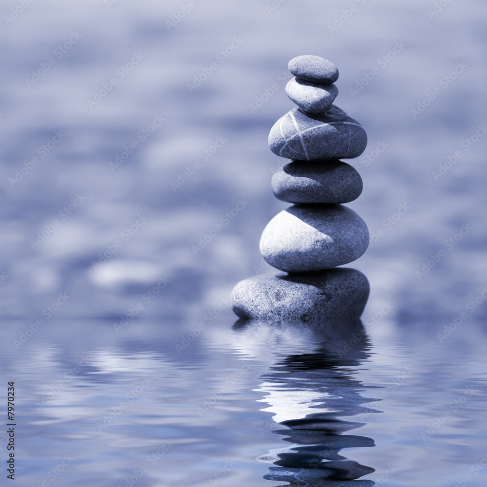 balanced stones on the water