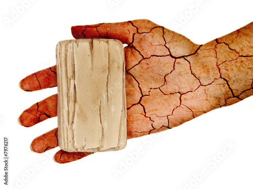 Valokuva Cracked hand holding dry soap