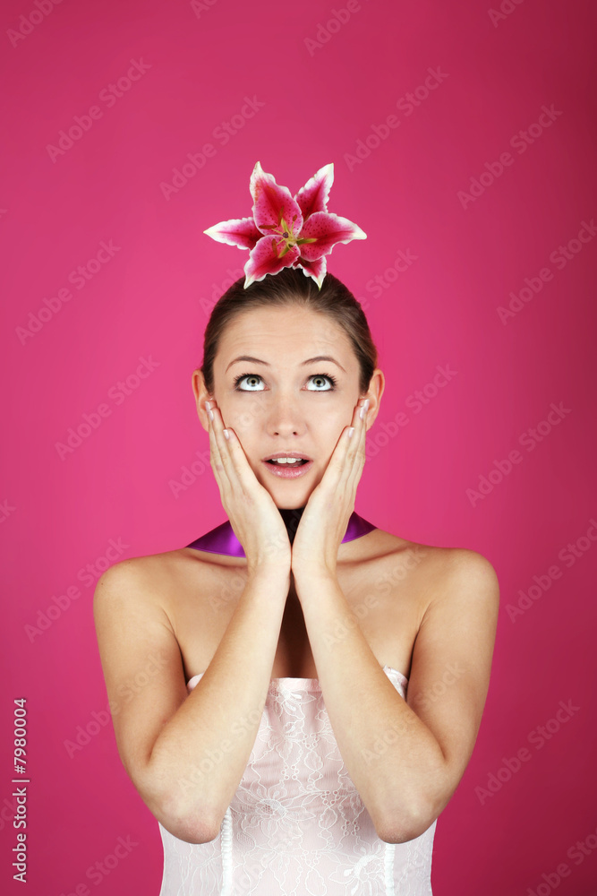 funny beauty portrait of a woman with a flower on her haid