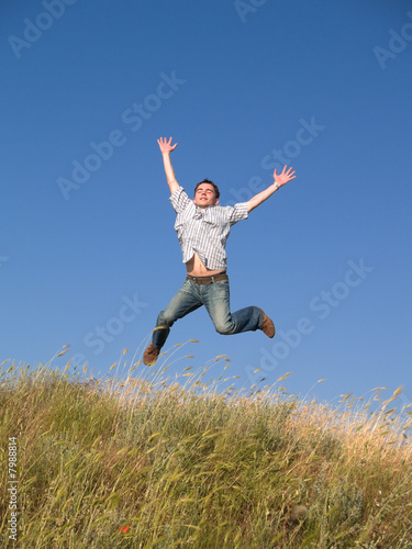 Happy Jumping Teenager Above Hill