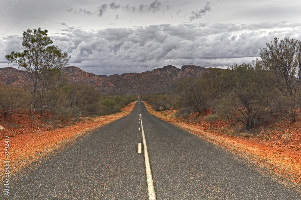 Fototapeta premium Endless desert road in the West MacDonnell Ranges