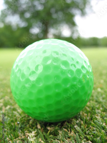Green golf ball on green