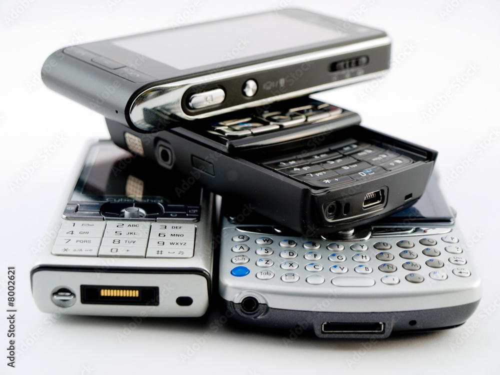 Stack Pile of Several Modern Mobile Phones PDA Cell Handheld Uni Stack Pile of Several Modern Mobile Phones PDA Cell Handheld Uni