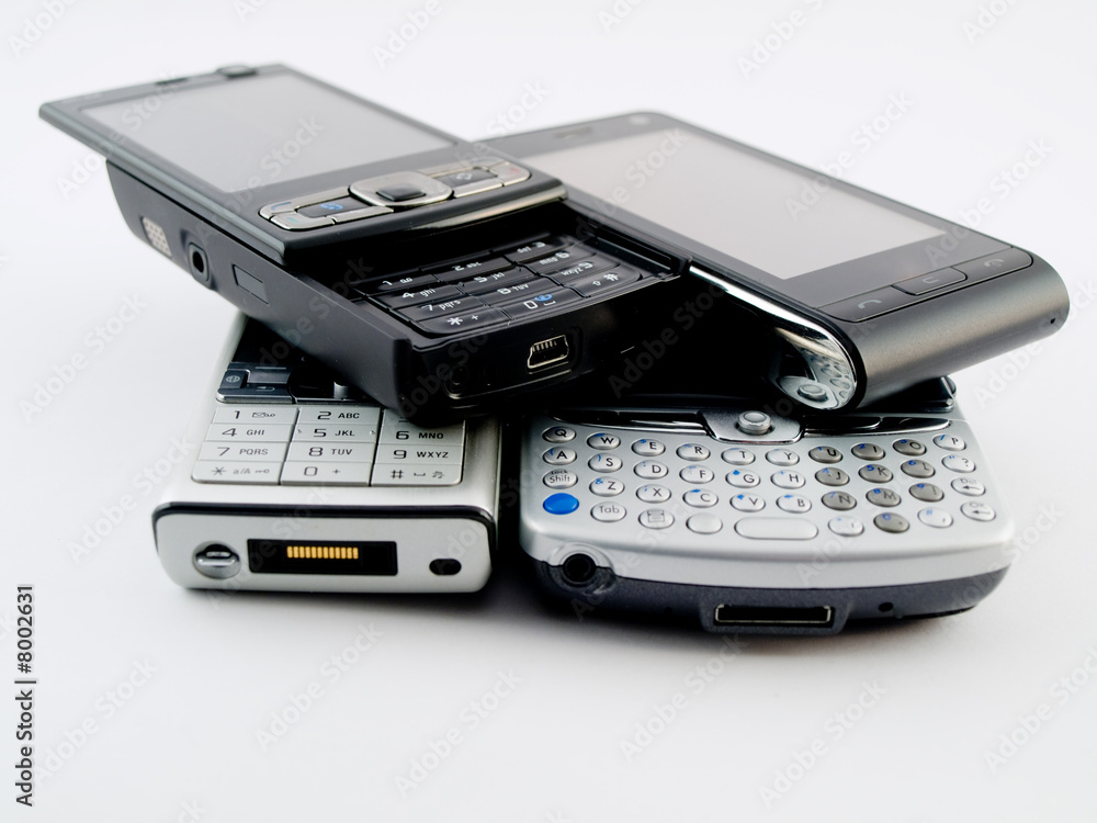 Stack Pile of Several Modern Mobile Phones PDA Cell Handheld Uni Stack Pile of Several Modern Mobile Phones PDA Cell Handheld Uni