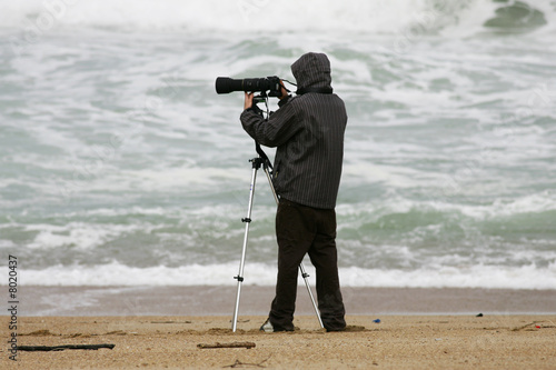 photographe en action sur la plage