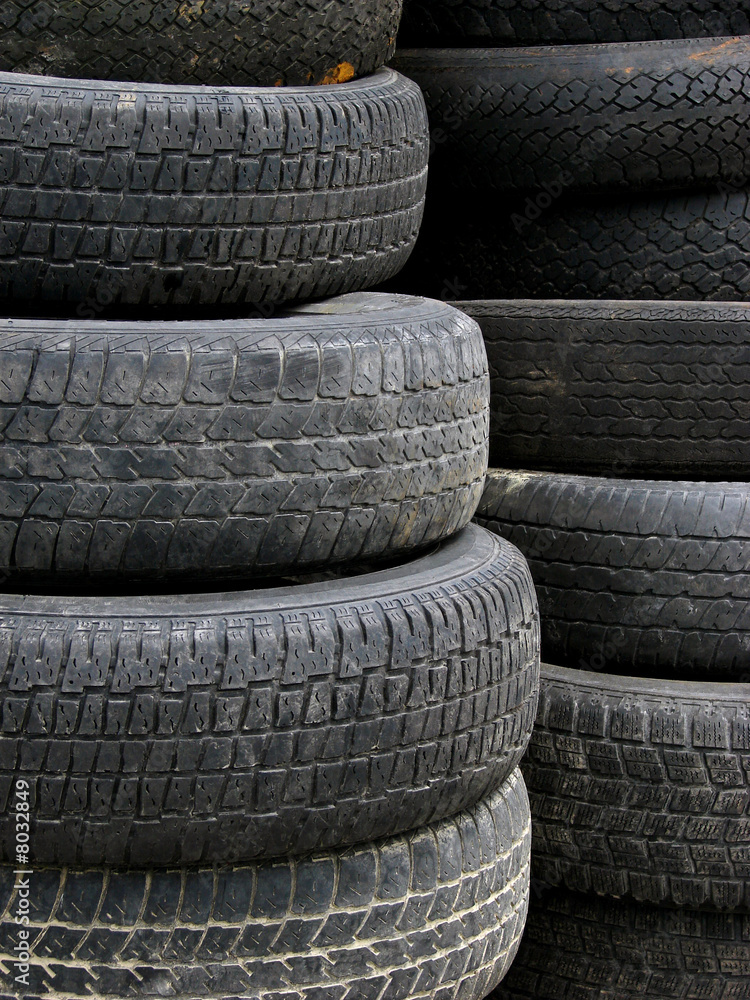 Old useless tires stacked up Old useless tires stacked up