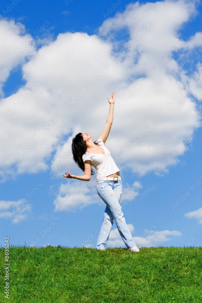 expressive woman dancing on green grass expressive woman dancing on green grass