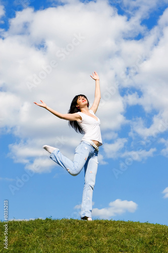 expressive young woman is jumping