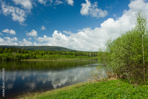 Fototapeta Naklejka Na Ścianę i Meble -  Summer landscape. Clouds above the river.