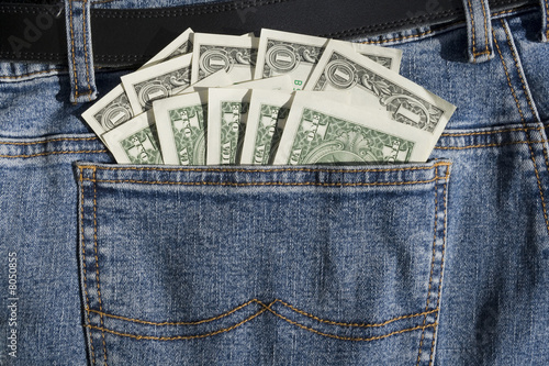 Fotografia US Dollars Cash in Back Pocket of Blue Jeans