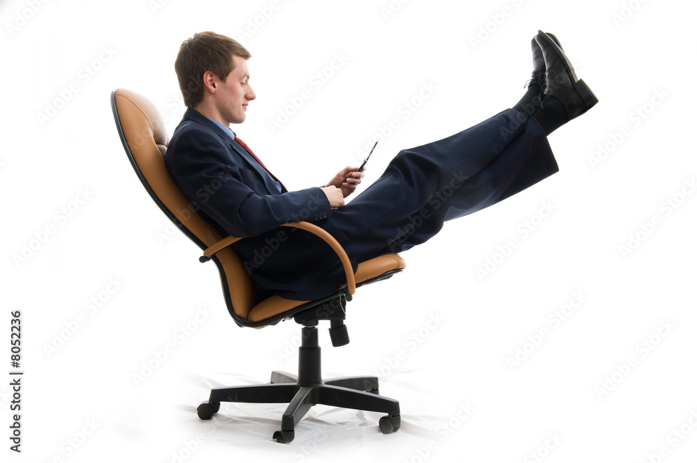 Young businessman relaxed in chair. Young businessman relaxed in chair.