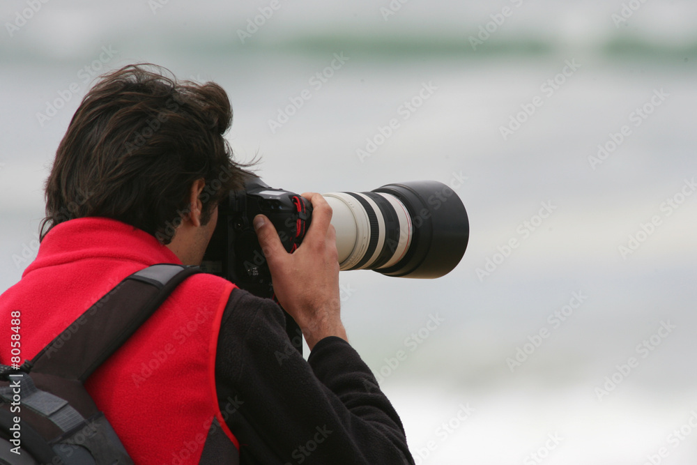 photographe en action sur la plage