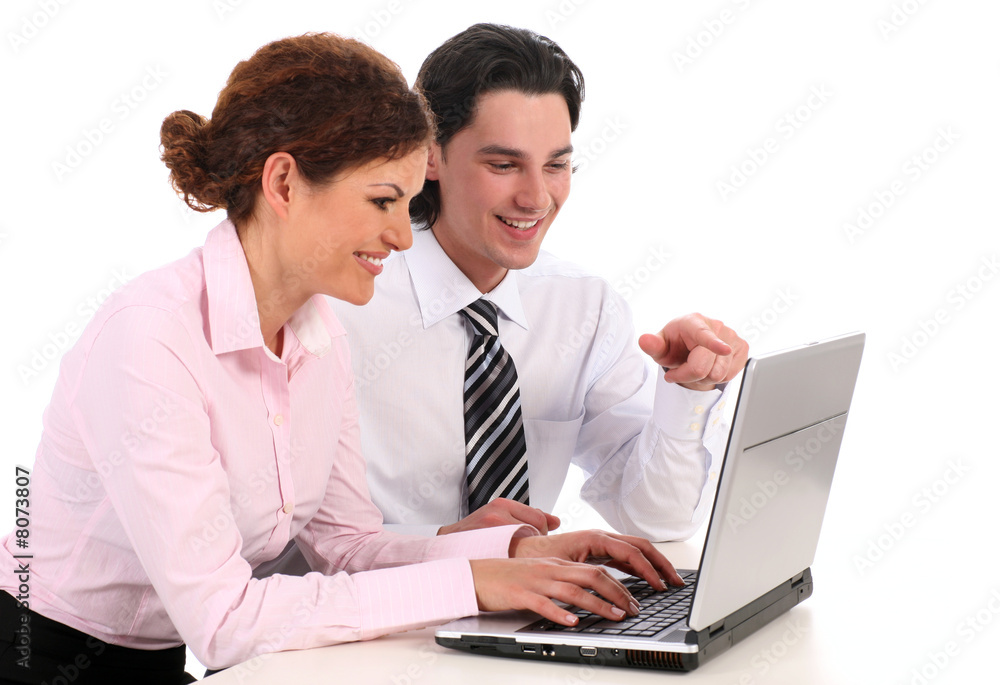 Businesswoman and businessman working on laptop computer Businesswoman and businessman working on laptop computer