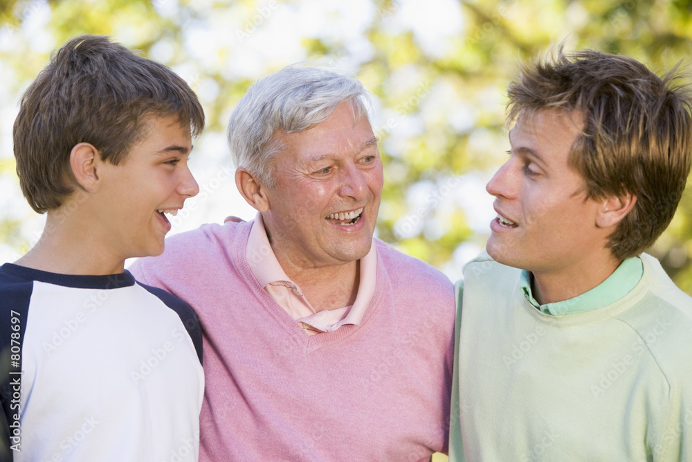 Grandfather with son and grandson smiling Grandfather with son and grandson smiling