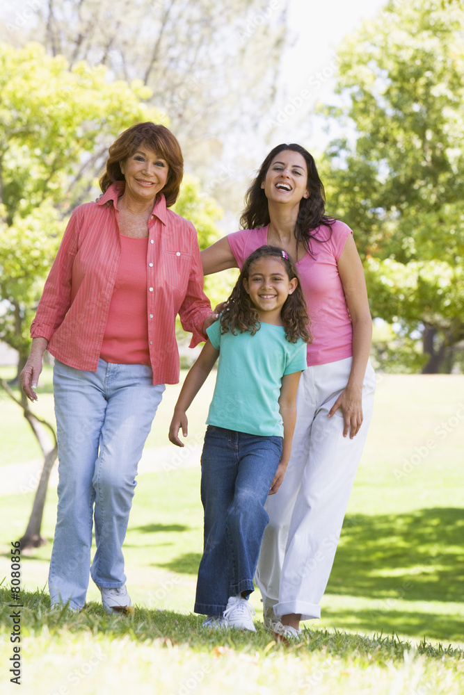 Grandmother with adult daughter and grandchild in park Grandmother with adult daughter and grandchild in park