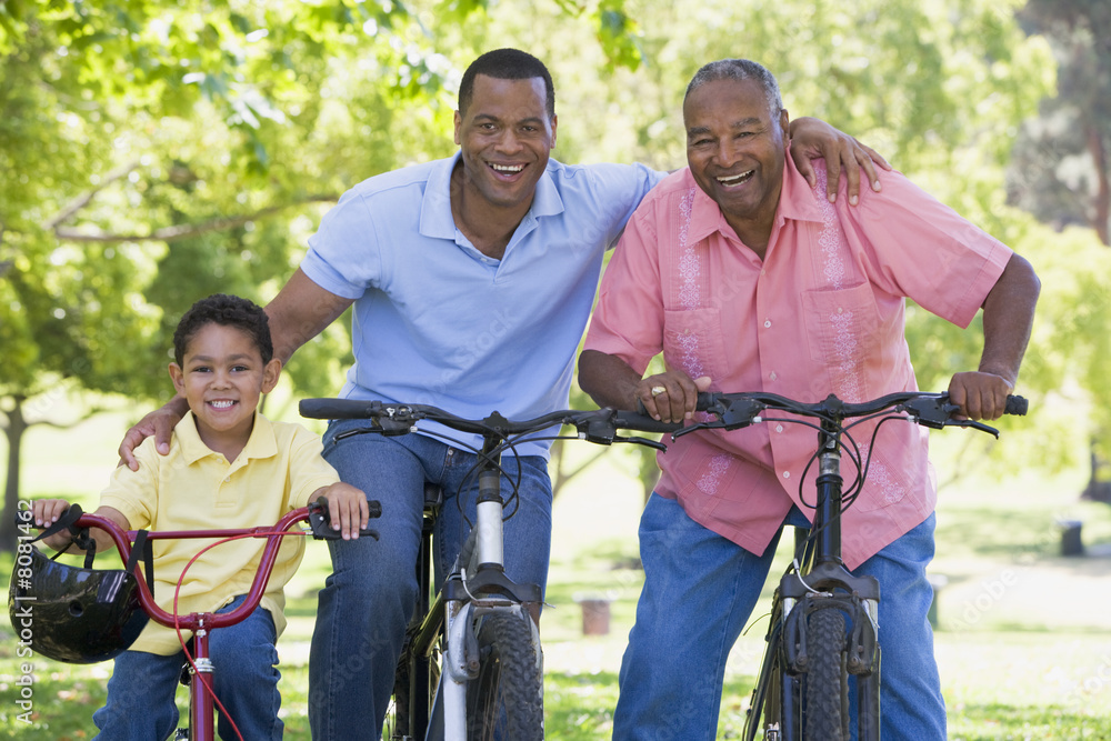 Obraz premium Grandfather grandson and son bike riding