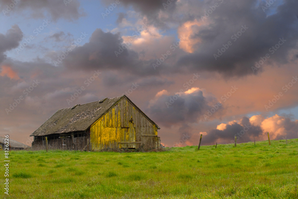 Old weathered abandoned barn in a field Old weathered abandoned barn in a field