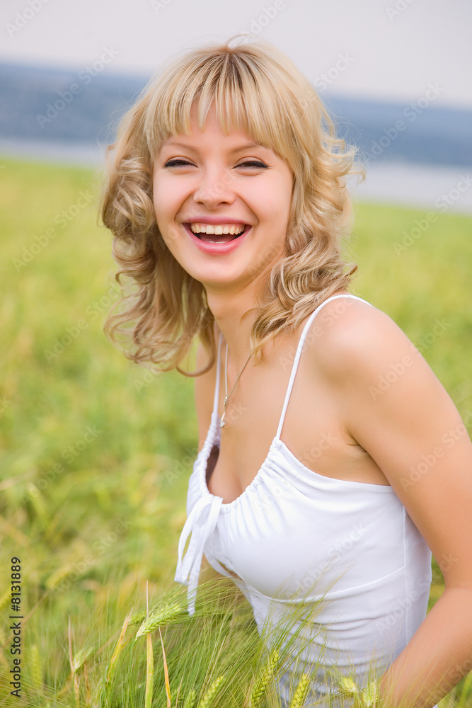 Smiling girl in the field of wheat Smiling girl in the field of wheat