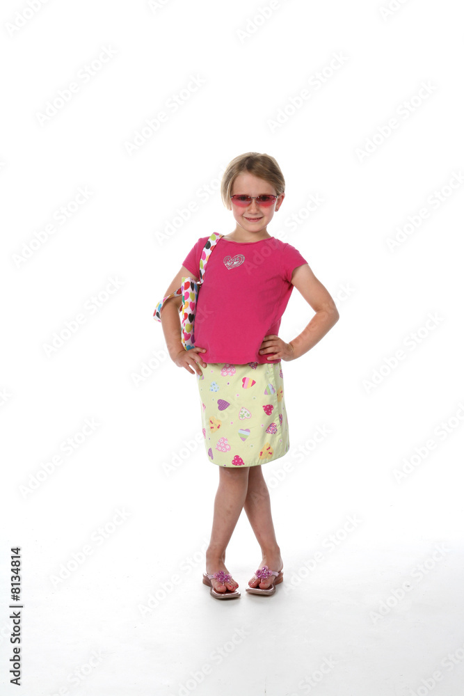 Cute girl in sunglasses, pink shirt and patterned skirt Cute girl in sunglasses, pink shirt and patterned skirt