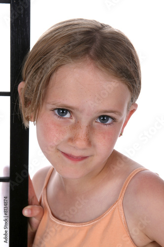 Pretty little girl with freckles on her nose